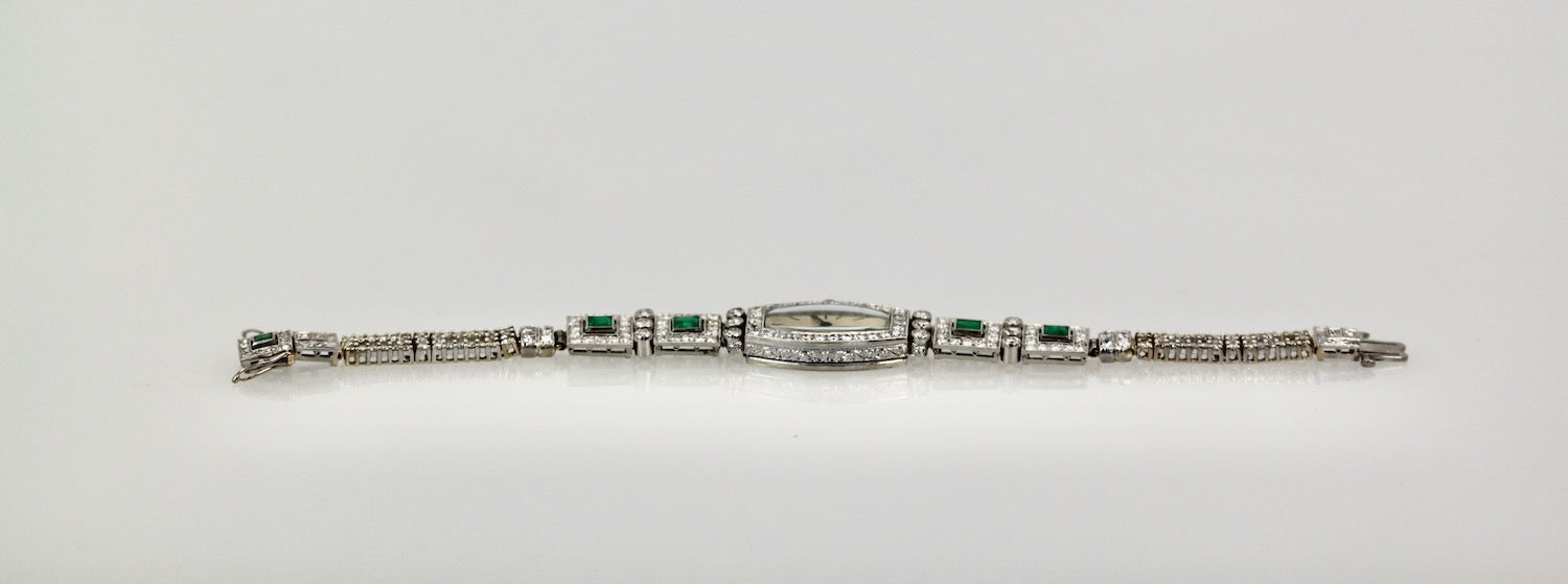 Silver bracelet with green gemstones