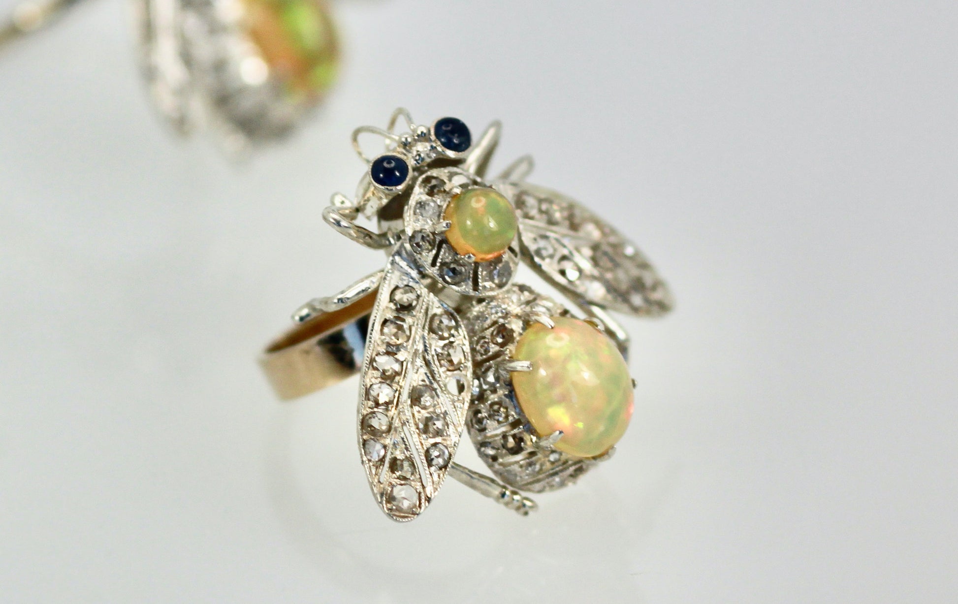 Mixed metal butterfly with opal