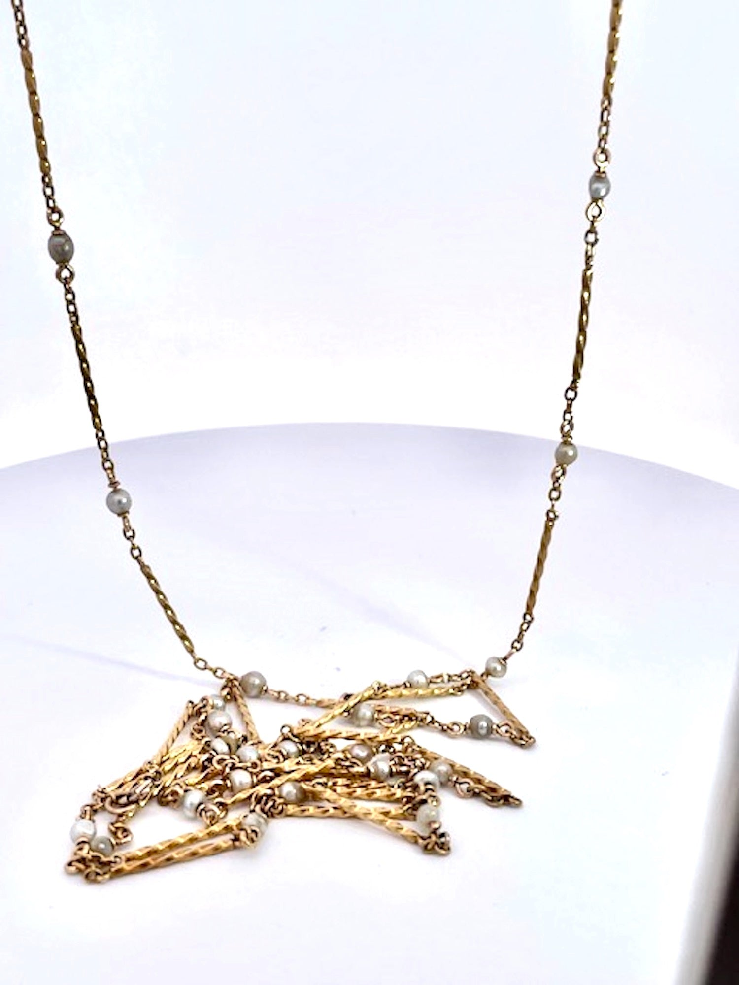 Gold chain necklace with small pearls