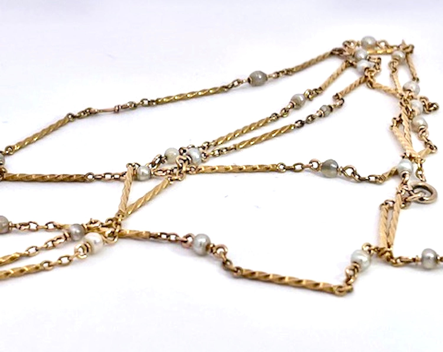 Gold chain necklace with small pearls