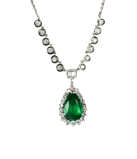 Emerald ring with diamond surround