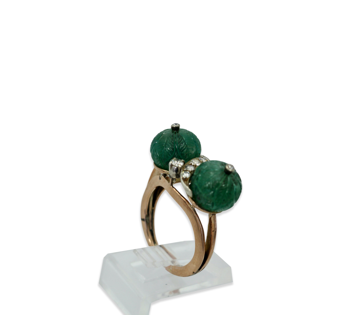 Diamond ring with carved emeralds