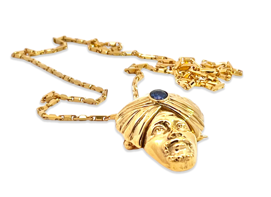 Gold genie necklace with sapphire
