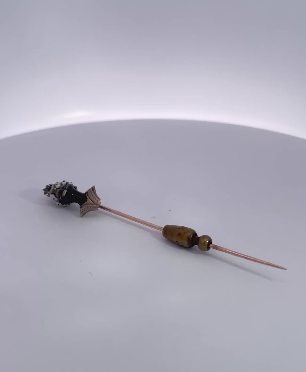 Moretto Stickpin with Coral Head and Ruby Cabochon 9K