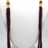 Triple Strand Ruby Bead Necklace with Diamonds - hanging on model