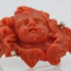Antique Hand Carved Coral Putti Cherub Angel Brooch - up angle