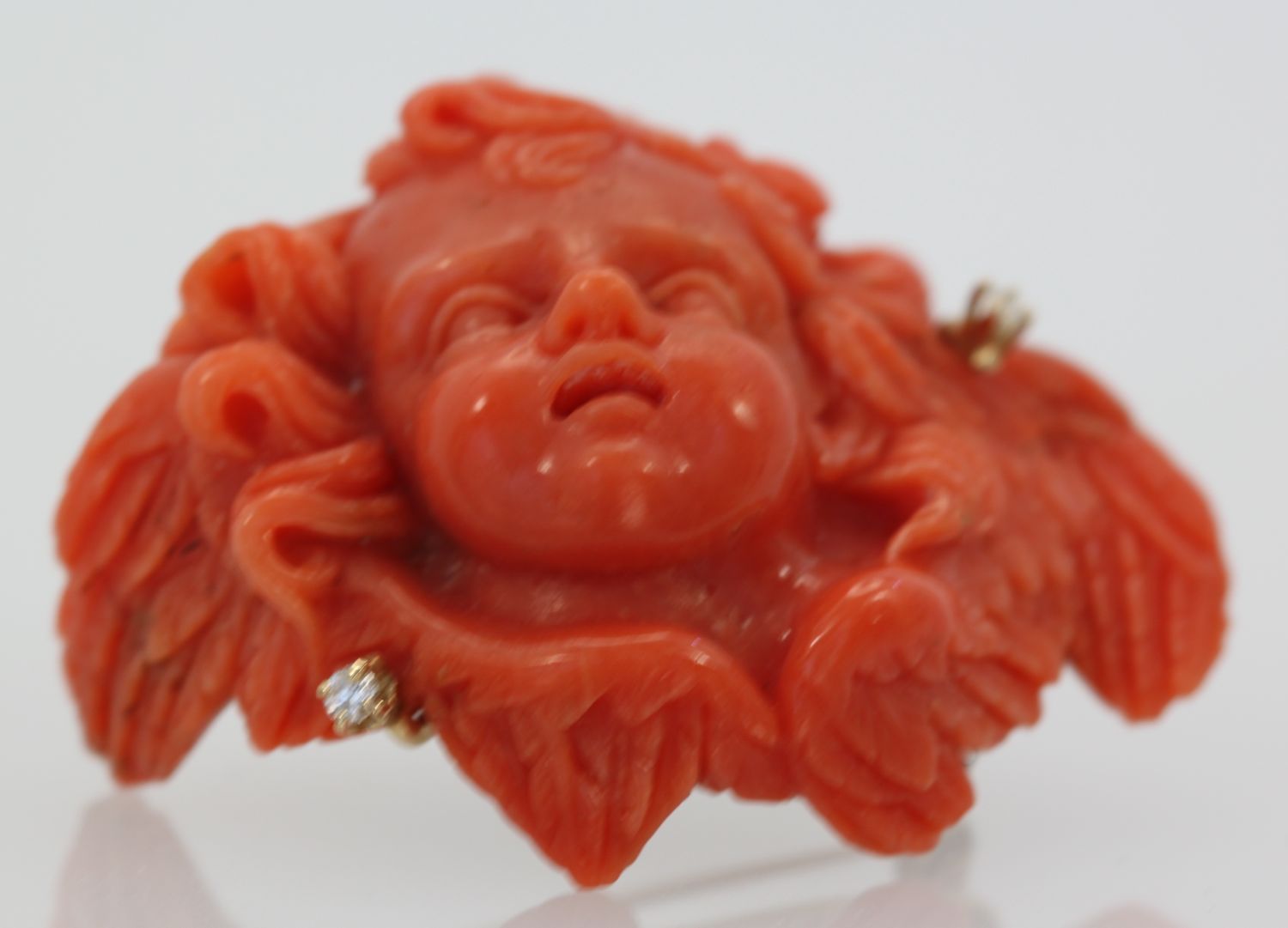 Antique Hand Carved Coral Putti Cherub Angel Brooch – up angle
