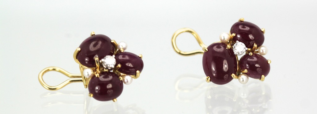 Seaman Schepps Ruby Cabochon Pierced Earrings With 3 Seed Pearls And 1 Diamond 18K lying flat