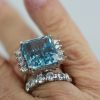 Aquamarine Ring with Diamond side stones on finger