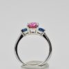 Three-Stone Ring in Pink and Blue Sapphires - bottom on stand