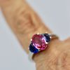Three-Stone Ring in Pink and Blue Sapphires - on finger