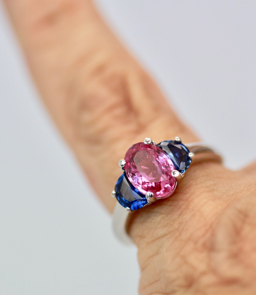 Three-Stone Ring in Pink and Blue Sapphires – on finger #2