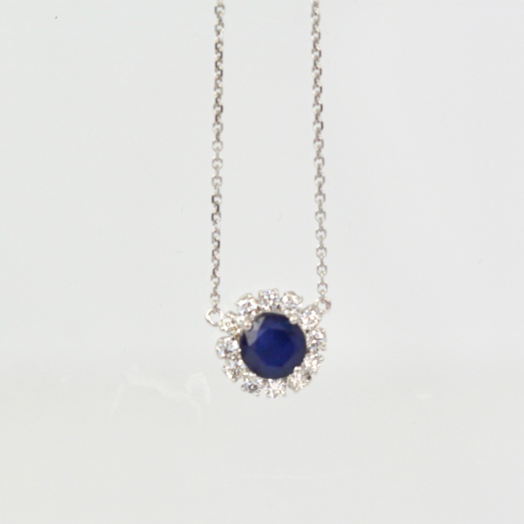 Blue Sapphire Pendant Necklace with Diamond Surround – hanging close up