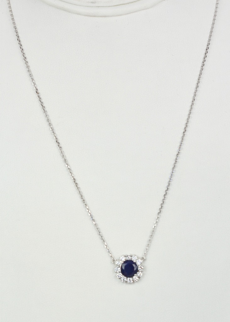 Blue Sapphire Pendant Necklace with Diamond Surround –  model wide view