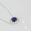 Blue Sapphire Pendant Necklace with Diamond Surround - angle