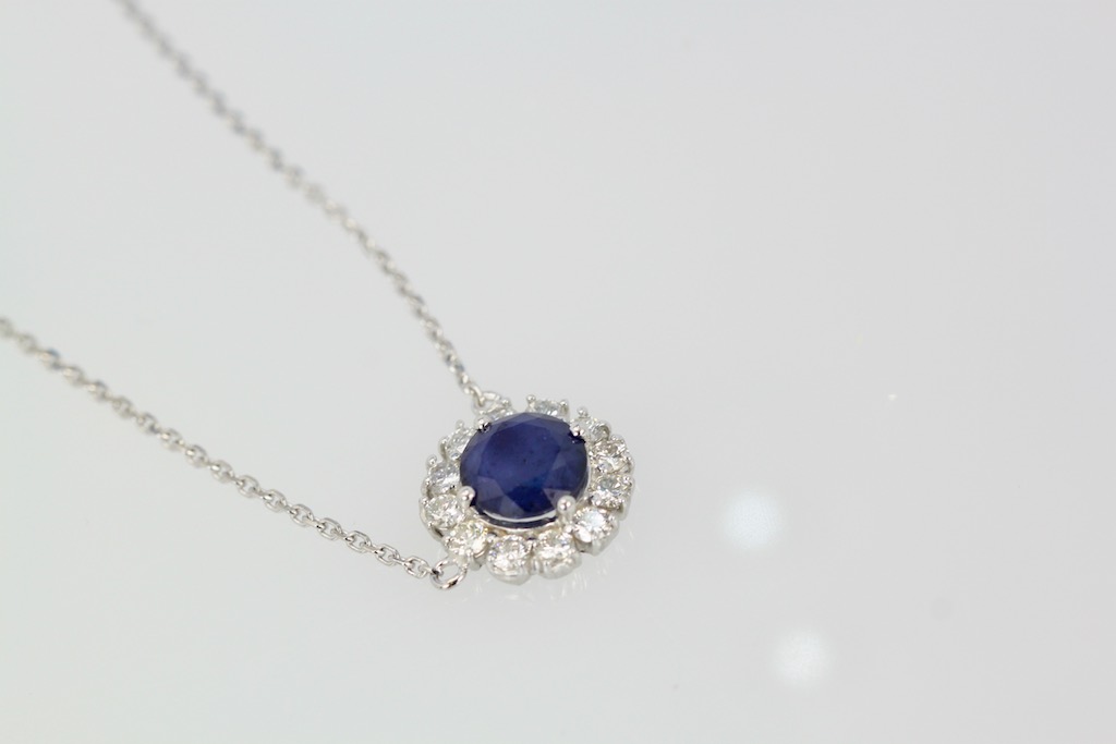Blue Sapphire Pendant Necklace with Diamond Surround – angle