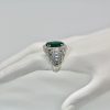 Oval Emerald 12.25 Carat Diamond Ring - side angle on model