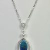 Black Crystal Opal Pendant with Diamond Surround - hanging