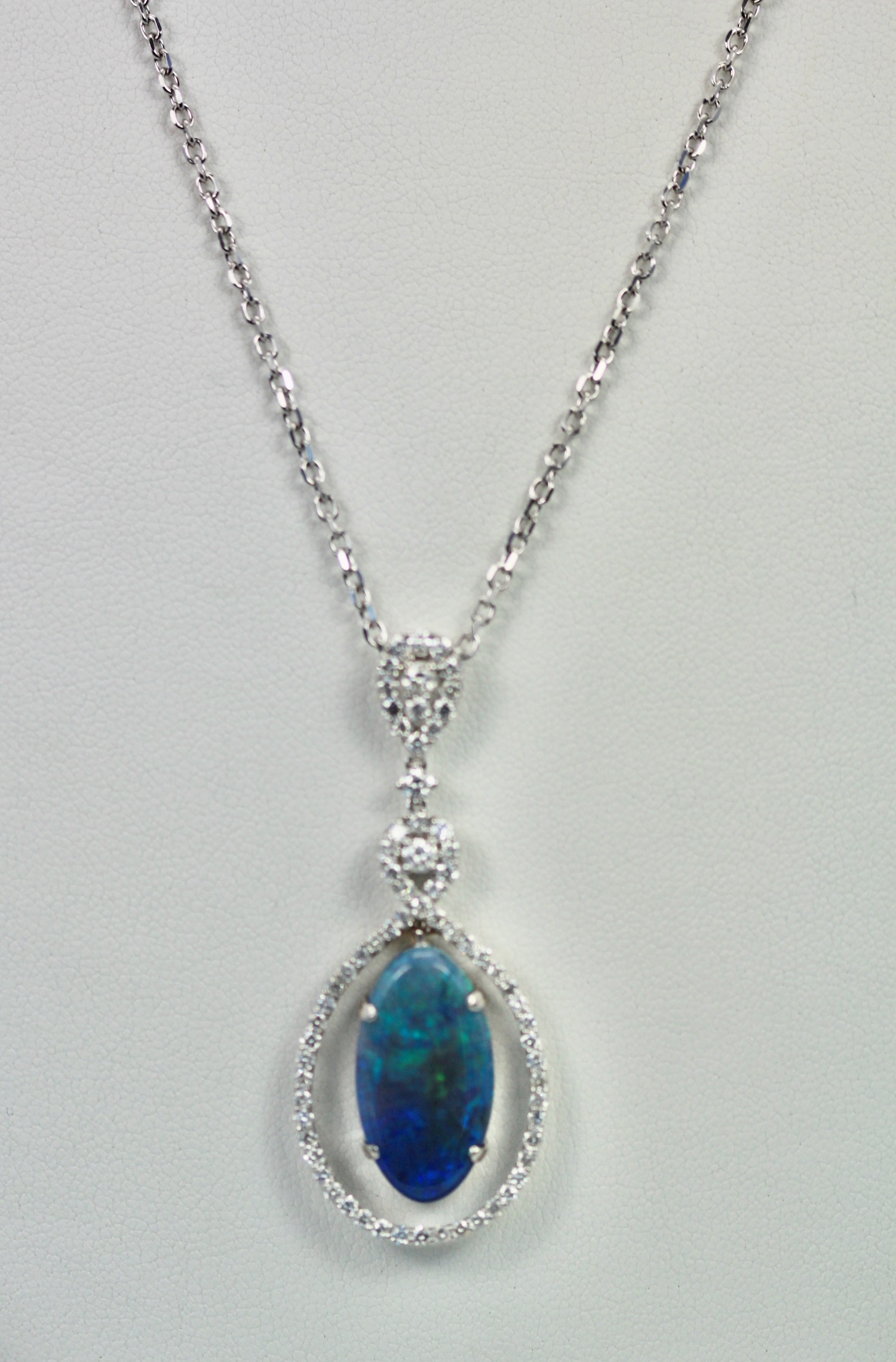 Black Crystal Opal Pendant with Diamond Surround – hanging