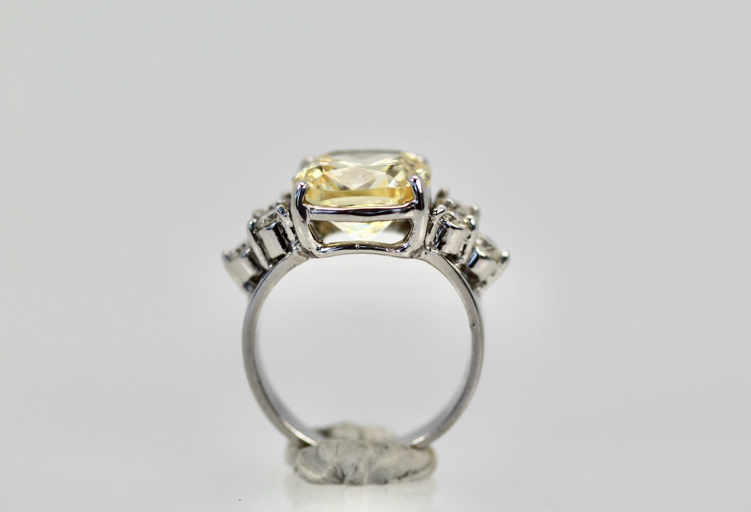 Large Yellow Sapphire Ring with Diamond Side Accents – on stand