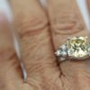 Large Yellow Sapphire Ring with Diamond Side Accents - on finger