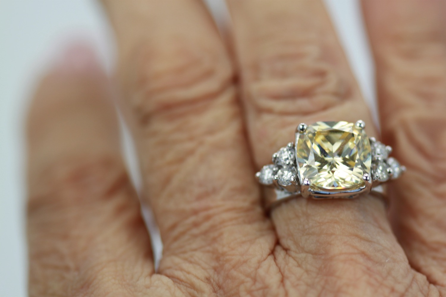 Large Yellow Sapphire Ring with Diamond Side Accents – on finger